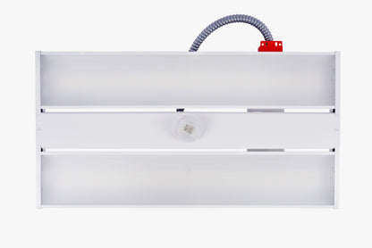 Front view of white linear LED high bay with centre occupancy sensor
