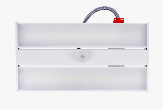 Front view of white linear LED high bay with centre occupancy sensor