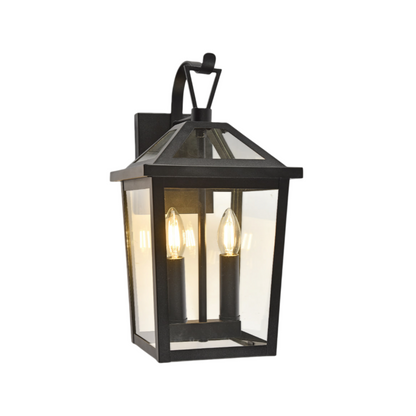 Black outdoor wall lantern with clear glass on a white background