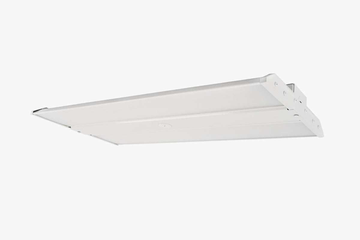 Underside angled view of white linear LED high bay with twin diffuser panels