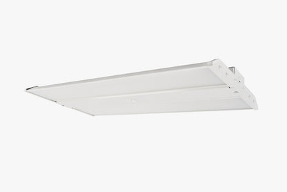 Underside angled view of white linear LED high bay with twin diffuser panels