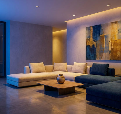 Modern living room with a sectional sofa, coffee table, and abstract painting.