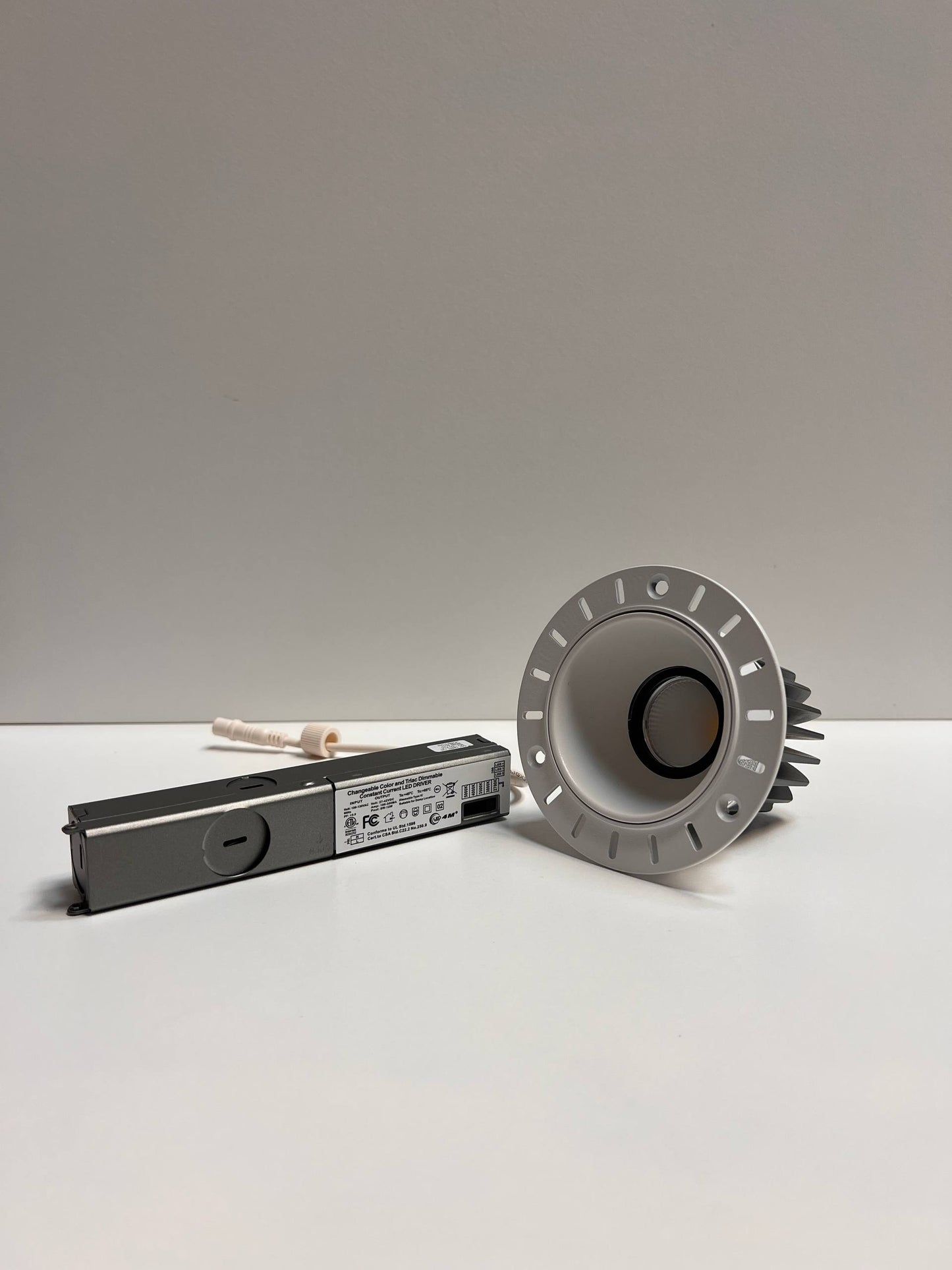 Metallic cylindrical component and rectangular module on a light gray background | Selix Kala