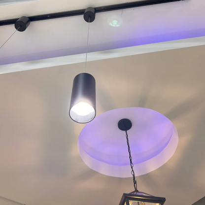 Ceiling lights on a white ceiling with a purple hue